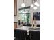 Open dining room with modern chandelier and an expansive view of the backyard at 1604 Sylvester Rd, Lakeland, FL 33803