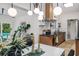 Open kitchen and dining area with stainless appliances and backyard views at 1604 Sylvester Rd, Lakeland, FL 33803