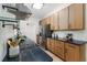 Modern kitchen boasts stainless appliances, dark countertops, and stylish lighting at 1604 Sylvester Rd, Lakeland, FL 33803