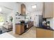 Well-lit kitchen with stainless steel appliances, modern cabinetry, and open layout to living area at 1604 Sylvester Rd, Lakeland, FL 33803