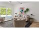 Bright living room with sliding glass doors and a view of the backyard pool, filled with natural light at 1604 Sylvester Rd, Lakeland, FL 33803