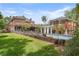Brick home with a lush backyard, brick fence, and inviting pool at 1760 Old Bartow Eagle Lake Rd, Bartow, FL 33830