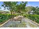 Backyard with framed black plastic canvas on wood frame at 1760 Old Bartow Eagle Lake Rd, Bartow, FL 33830