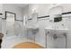 Bathroom with black and white tiles, double sinks, and a glass shower at 1760 Old Bartow Eagle Lake Rd, Bartow, FL 33830