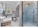 A classic bathroom with a shower stall, blue tile, and a white porcelain sink at 1760 Old Bartow Eagle Lake Rd, Bartow, FL 33830