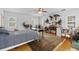 Spacious bedroom with hardwood floors, four windows, and a ceiling fan at 1760 Old Bartow Eagle Lake Rd, Bartow, FL 33830