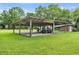 Large carport area with high ceilings and a lawn in the background at 1760 Old Bartow Eagle Lake Rd, Bartow, FL 33830