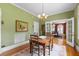 Bright dining area with hardwood floors, natural light, and classic French doors to another room at 1760 Old Bartow Eagle Lake Rd, Bartow, FL 33830