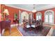 Formal dining room boasting an ornate chandelier, wood floors, and arched doorways for an open feel at 1760 Old Bartow Eagle Lake Rd, Bartow, FL 33830