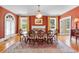 Elegant dining room with a large table, chandelier, and hardwood floors at 1760 Old Bartow Eagle Lake Rd, Bartow, FL 33830