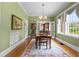 Inviting dining room with hardwood floors, natural light, and classic French doors at 1760 Old Bartow Eagle Lake Rd, Bartow, FL 33830