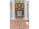 Inviting entrance with large white columns, beautiful brickwork, and a welcoming front door at 1760 Old Bartow Eagle Lake Rd, Bartow, FL 33830