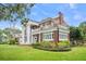 An expansive brick home with white columns and balcony with mature landscaping at 1760 Old Bartow Eagle Lake Rd, Bartow, FL 33830