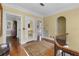 Second floor landing with wood floors, arched doorway, and access to multiple rooms at 1760 Old Bartow Eagle Lake Rd, Bartow, FL 33830
