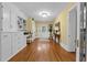 Hallway with built-in desk and shelving, hardwood floors, and classic decor accents at 1760 Old Bartow Eagle Lake Rd, Bartow, FL 33830