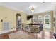 Second floor landing with wood floors, chandelier, and arched windows with a view at 1760 Old Bartow Eagle Lake Rd, Bartow, FL 33830