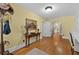 Entry hallway featuring hardwood floors, classic décor, and access to other rooms at 1760 Old Bartow Eagle Lake Rd, Bartow, FL 33830