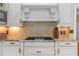 Close up of kitchen with granite countertops, tiled backsplash, and stainless steel appliances at 1760 Old Bartow Eagle Lake Rd, Bartow, FL 33830