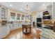 Charming kitchen features granite countertops, custom cabinets, and hardwood floors at 1760 Old Bartow Eagle Lake Rd, Bartow, FL 33830