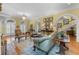 Elegant living room featuring hardwood floors, a fireplace, arched doorways and bright walls at 1760 Old Bartow Eagle Lake Rd, Bartow, FL 33830
