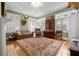 Bright living room with fireplace, large windows, and area rug at 1760 Old Bartow Eagle Lake Rd, Bartow, FL 33830