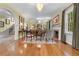 Elegant living room featuring hardwood floors, a fireplace, and arched doorways at 1760 Old Bartow Eagle Lake Rd, Bartow, FL 33830