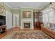 Inviting living room with a cozy fireplace, detailed rug, and a comfortable couch at 1760 Old Bartow Eagle Lake Rd, Bartow, FL 33830