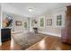 Spacious living room with hardwood floors and large windows providing natural light at 1760 Old Bartow Eagle Lake Rd, Bartow, FL 33830