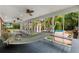 Relaxing screened-in porch with hammock overlooking pool and backyard at 1760 Old Bartow Eagle Lake Rd, Bartow, FL 33830