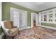 Cozy sunroom with unique tile flooring, comfortable seating, and lots of natural light from multiple windows at 1760 Old Bartow Eagle Lake Rd, Bartow, FL 33830