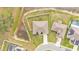 Aerial view of a home with a fenced backyard, and nearby homes with pools at 185 Heritage Park Ln, Mulberry, FL 33860