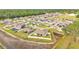 Aerial view of a neighborhood featuring well-maintained lawns and community landscaping at 185 Heritage Park Ln, Mulberry, FL 33860