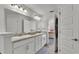 Elegant bathroom featuring double sinks, granite countertops, and neutral color scheme at 185 Heritage Park Ln, Mulberry, FL 33860