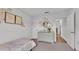 Cozy bedroom featuring a comfortable bed and a view of the backyard at 185 Heritage Park Ln, Mulberry, FL 33860