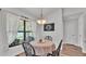 Bright dining area featuring a charming breakfast nook table and window at 185 Heritage Park Ln, Mulberry, FL 33860