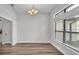 Simple dining room with modern lighting and hardwood floors at 185 Heritage Park Ln, Mulberry, FL 33860