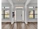 Bright and welcoming foyer with modern accents and lots of natural light at 185 Heritage Park Ln, Mulberry, FL 33860