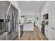 Open kitchen featuring stainless steel appliances, bright countertops, and white cabinets at 185 Heritage Park Ln, Mulberry, FL 33860