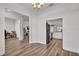 Open-concept living and kitchen area with modern appliances and hardwood flooring at 185 Heritage Park Ln, Mulberry, FL 33860