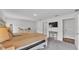 Cozy main bedroom with TV, dresser, and adjacent bathroom entrance at 185 Heritage Park Ln, Mulberry, FL 33860