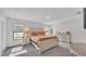 Spacious main bedroom with natural light, neutral color palette, and carpet flooring at 185 Heritage Park Ln, Mulberry, FL 33860