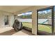 Covered patio overlooking a fenced backyard with green grass and a playground set at 185 Heritage Park Ln, Mulberry, FL 33860