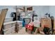 Basement with a lot of storage containers, a metal plant stand, and a red utility cart at 1925 Binnacle St, Kissimmee, FL 34744