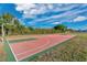 Outdoor basketball court with hoops and a colorful playing surface, perfect for recreation at 1925 Binnacle St, Kissimmee, FL 34744