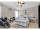 Bright bedroom featuring a decorative 'LOVE' wall, vanity, and seating bench offers a relaxing space at 1925 Binnacle St, Kissimmee, FL 34744