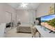 Cozy bedroom featuring a mirrored closet, neutral decor, and a view of the ocean on TV at 1925 Binnacle St, Kissimmee, FL 34744