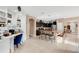 Open-concept kitchen featuring dark cabinets, stainless steel appliances, a large island with seating, and ample counter space at 1925 Binnacle St, Kissimmee, FL 34744