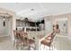 Modern kitchen featuring a large island with seating, stainless steel appliances, and dark cabinetry, perfect for cooking at 1925 Binnacle St, Kissimmee, FL 34744