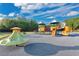 Community playground featuring colorful play structures, slides, and a soft, safe surface at 1925 Binnacle St, Kissimmee, FL 34744