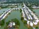 Aerial view of a waterfront community with manufactured homes on canals and lakes surrounded by mature trees at 2055 S Floral Ave # 269, Bartow, FL 33830
